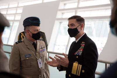 Air Marshal Martin Sampson speaks with Vice Admiral Brad Cooper, commander of US Naval Forces Central Command, US Fifth Fleet and Combined Maritime Forces, at a robotics exhibition in Abu Dhabi. Alamy