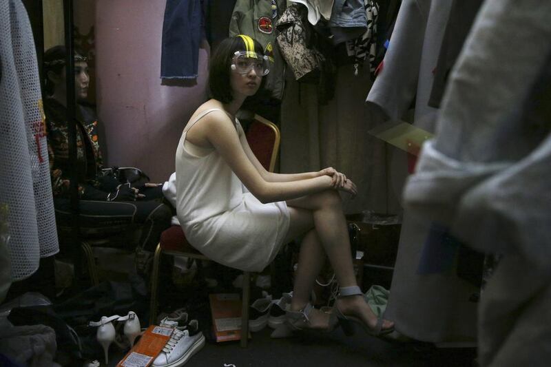 A model waits backstage before a fashion show in Beijing. Wu Hong / EPA