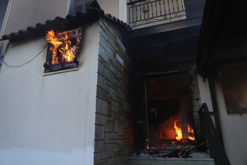 This house caught alight during a wildfire in Megara, Greece.    EPA 