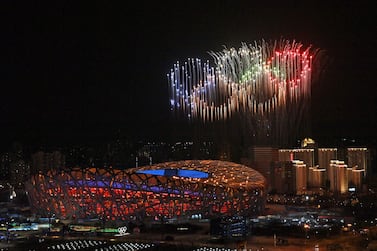 Fireworks in the shape of the Olympic rings go off over the National Stadium, known as the Bird's Nest, in Beijing, during the opening ceremony of the Beijing 2022 Winter Olympic Games, on February 4, 2022. (Photo by LI Xin / POOL / AFP)