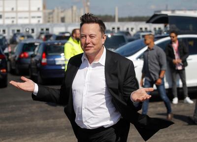 (FILES) In this file photo taken on September 3, 2020 Tesla CEO Elon Musk gestures as he arrives to visit the construction site of the future US electric car giant Tesla, in Gruenheide near Berlin. This week, Tesla boss Elon Musk criticized bitcoin's power consumption, particularly of energy produced from coal, and said he would no longer accept the cryptocurrency as payment for his electric cars. / AFP / Odd ANDERSEN
