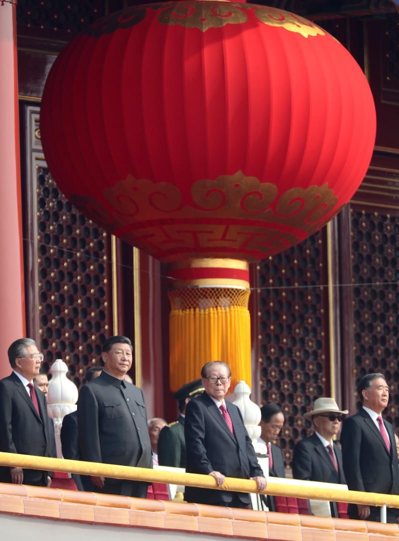 Chinese President Xi Jinping, second from left, with former presidents Jiang Zemin, center right, and Hu Jintao, left. AP