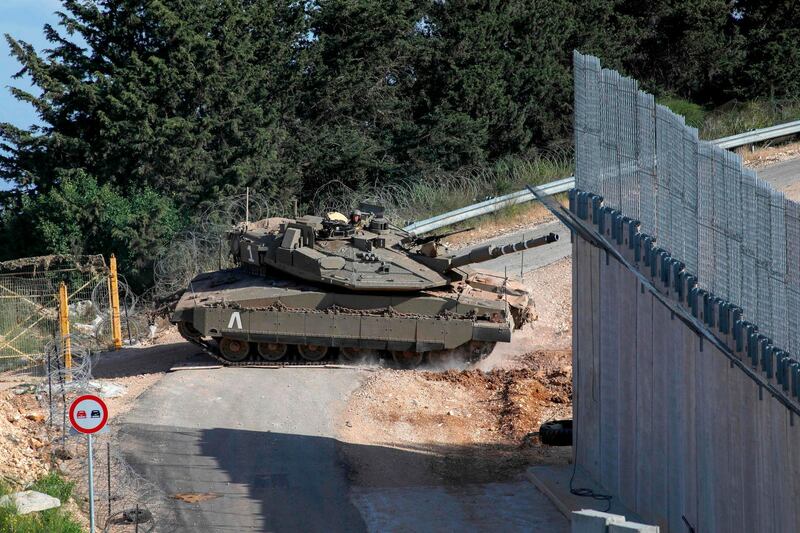 An Israeli army Merkava IV battle tank takes part in an exercise near the "blue line close the Lebanese village of Adaisseh. AFP