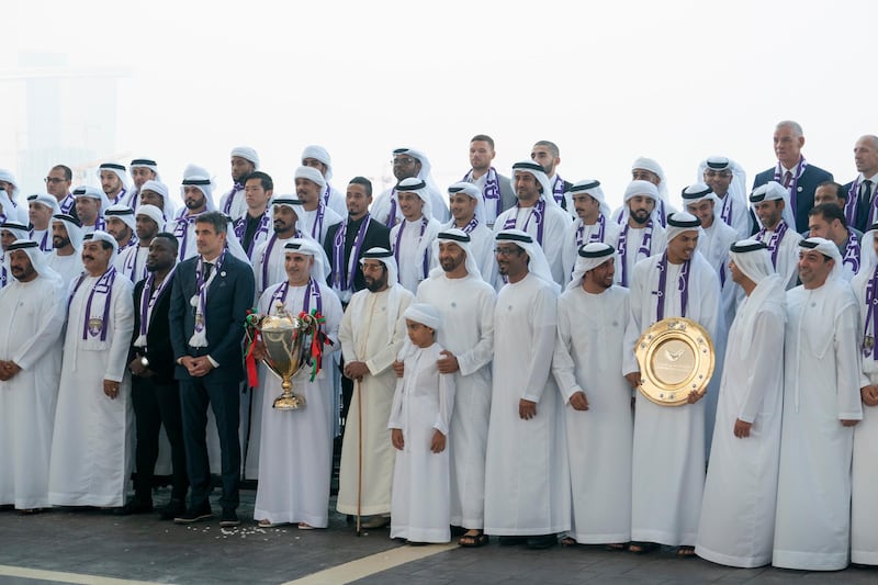 ABU DHABI, UNITED ARAB EMIRATES - October 01, 2018: HH Sheikh Mohamed bin Zayed Al Nahyan Crown Prince of Abu Dhabi Deputy Supreme Commander of the UAE Armed Forces (7th L), stands for a photograph with Al Ain Football Club, during a Sea Palace barza. Seen with  HH Sheikh Saeed bin Mohamed Al Nahyan (L),  HH Sheikh Tahnoon bin Mohamed Al Nahyan, Ruler's Representative in Al Ain Region (6th L), HH Sheikh Tahnoon bin Mohamed bin Tahnoon Al Nahyan (front row) and HH Sheikh Hazza bin Zayed Al Nahyan, Vice Chairman of the Abu Dhabi Executive Council (11th L).

( Hamad Al Kaabi / Crown Prince Court - Abu Dhabi )
---