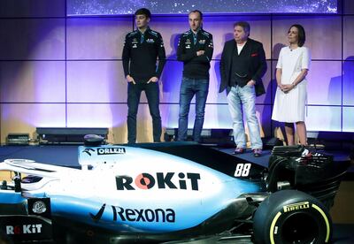 Unveiling of the new livery FW42 with from left, drivers George Russell and Robert Kubica, with Chairman of Rok Corporation Jonathan Kendrick and Williams Formula One deputy team principal Claire Williams during the unveiling of the new Williams 2019 F1 car livery at Williams Conference Centre in Grove, England, Monday Feb. 11, 2019. (Adam Davy/PA via AP)