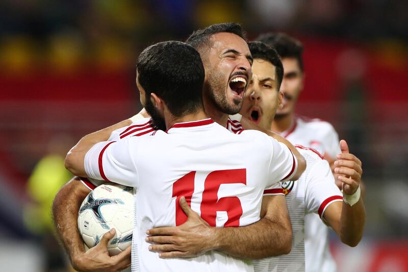 Ali Mabkhout of the UAE celebrates with teammates after making it 1-1. EPA