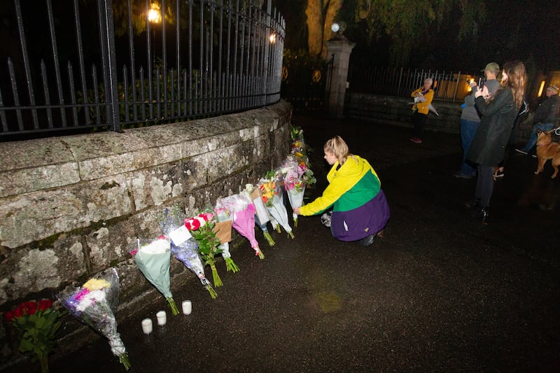 People lay floral tributes outside Balmoral Castle, Scotland, on Thursday night. EPA