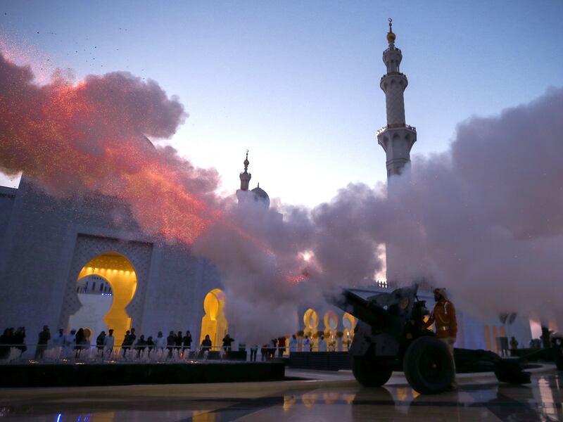 A cannon is fired at the Sheikh Zayed Grand Mosque to mark the end of fasting and start of Iftar on the first day of Ramadan. Victor Besa / The National