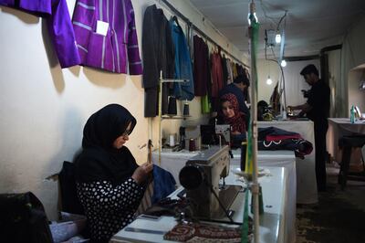 This photo taken on February 25, 2018 shows Afghan tailors sewing clothes at Zarif Design House in Kabul.
Cheap, Chinese-made nylon burkas are flooding Afghanistan's north as consumers turn to affordable, mass-produced fabrics -- but in Kabul a small, determined fashion house is fighting to preserve the traditional textiles once integral to Afghan culture.
 / AFP PHOTO / WAKIL KOHSAR / TO GO WITH Afghanistan-lifestyle-social-fashion,FEATURE by Anne Chaon