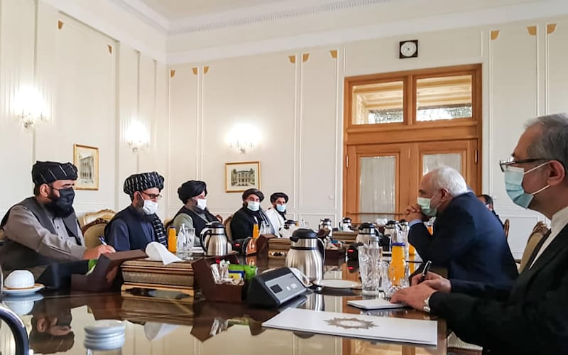 A picture obtained by AFP from the Iranian news agency Tasnim on January 31, 2021, shows 
Iran' Foreign Minister Mohammad Javad Zarif (2nd-R) meeting with Mullah Abdul Ghani Baradar (2nd-L) of the Taliban in Tehran. Iran's Foreign Minister Mohammad Javad Zarif called for the formation of an "all-inclusive" Afghan government during a meeting with a Taliban delegation in Tehran. A delegation from the movement headed by its co-founder Mullah Abdul Ghani Baradar arrived in Iran on January 26 to exchange "views on the peace process in Afghanistan" at the invitation of the ministry. / AFP / TASNIM NEWS / -
