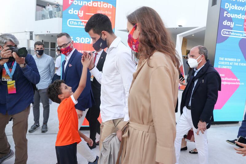 Novak Djokovic enters the Serbian pavilion on Thursday evening. Khushnum Bhandari / The National