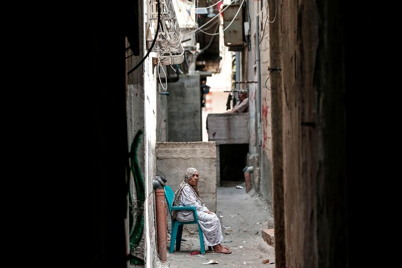 A Palestinian refugee sits in a street of the Al-Shati refugee camp in Gaza City. AFP