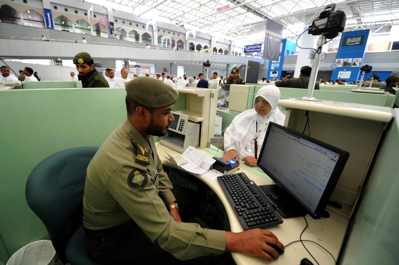 Muslim pilgrims go through passport control upon their arrival at Jeddah airport in the Saudi capital on July 14,2018, prior to the start of the annual Hajj pilgrimage in the holy city of Mecca. 
The Hajj, the largest annual pilgrimage in the world, is the fifth pillar of Islam, a religious duty that must be carried out at least once in the lifetime of every able-bodied Muslim who can afford to do so. / AFP PHOTO / Amer HILABI