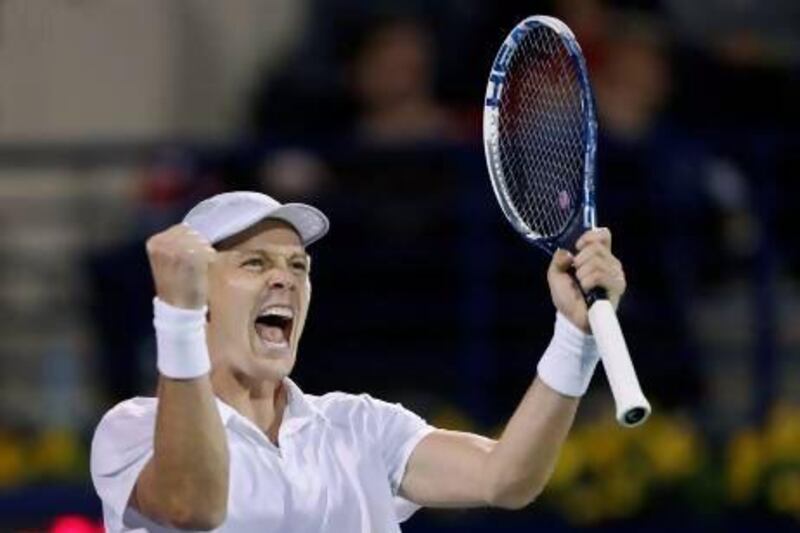 Tomas Berdych celebrates after his stunning comeback from a first set loss to Roger Federer. Mohammed Salem / Reuters