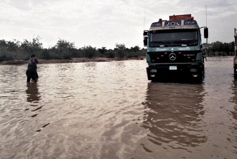 Sammy Dallal, The National photographer, was enroute to the Al Ruwais labour camp that is reportedly flooded, displacing hundreds of workers, but a stretch of the E11 is also flooded. Sammy Dallal / The National