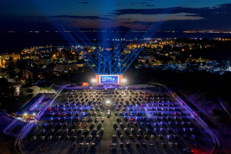 An aerial view shows the opening night of a drive-in festival in the southern Athens' suburb of Glyfada as Greece eases lockdown measures taken to curb the spread of Covid-19.  AFP