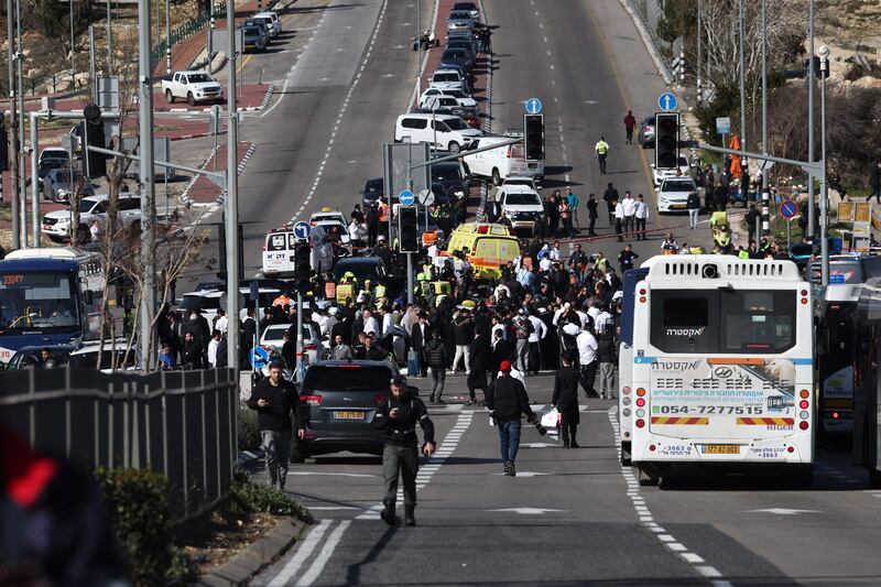 Responders gather at the site of the suspected attack. AFP