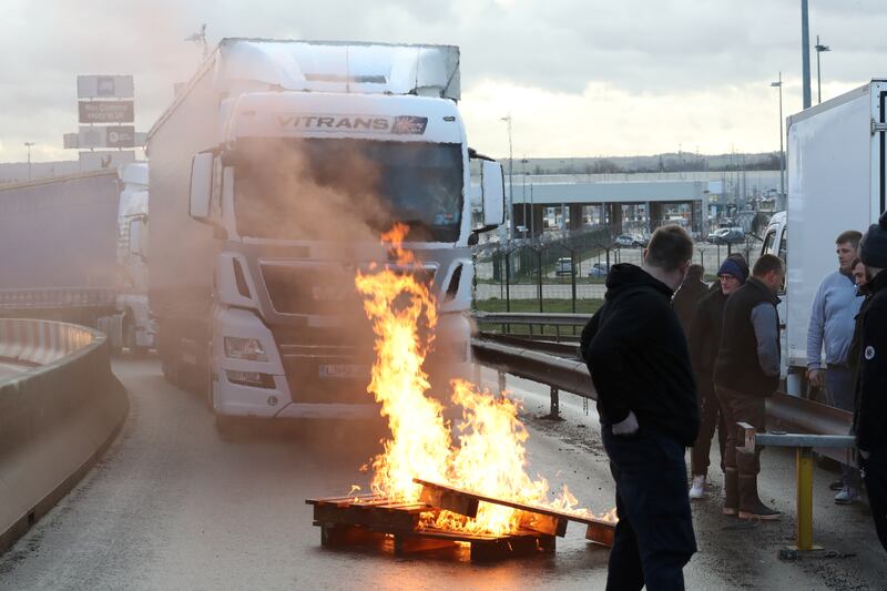 French fishermen block trucks at the Eurotunnel Freight Terminal during a day of protests to mark their anger over the issue of post-Brexit fishing licenses, in Coquelles, near Calais. Reuters