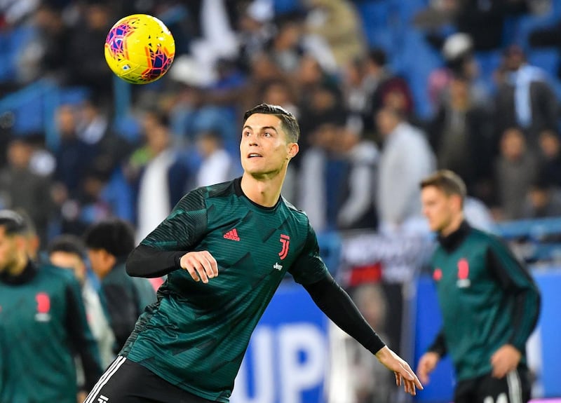 Juventus' Portuguese forward Cristiano Ronaldo warms up ahead of the Supercoppa Italiana final. AFP