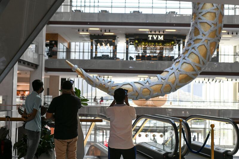 Visitors admire the decorations at Galleria Mall. Khushnum Bhandari / The National