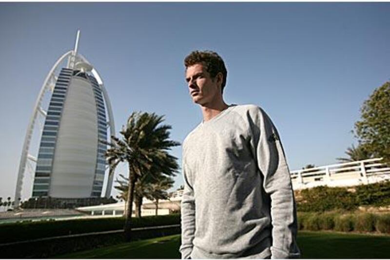 Andy Murray in front of the Burj Al Arab. The Briton says he is disappointed he will not face Roger Federer, who withdrew injured yesterday.