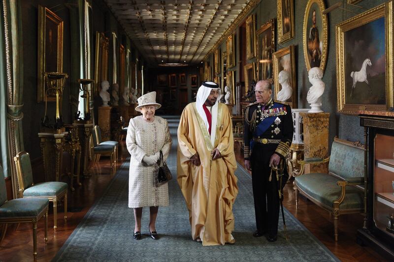 WINDSOR, ENGLAND - APRIL 30:  Queen Elizabeth II (L) and Prince Philip, Duke of Edinburgh (R), greet The President of the United Arab Emirates, His Highness Sheikh Khalifa bin Zayed Al Nahyan (C), in Windsor Castle on April 30, 2013 in Windsor, England. The President of the United Arab Emirates is paying a two-day State Visit to the United Kingdom, staying in Windsor Castle as the guest of Her Majesty The Queen from April 30, 2013 to May 1, 2013. Sheikh Khalifa will meet the British Prime Minister David Cameron tomorrow at his Downing Street residence.  (Photo by Oli Scarff/Getty Images) *** Local Caption ***  167796444.jpg