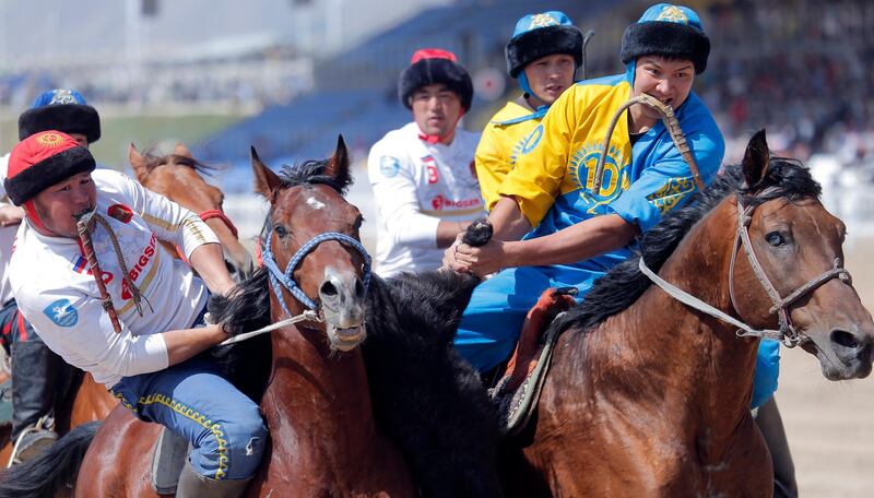 Kazakh and Russian horsemen take part in kok-boru. EPA