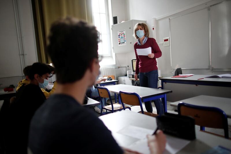 Christine Figer teaches German at the Lycee Buffon secondary school as students return to the classroom, in Paris, France. Reuters