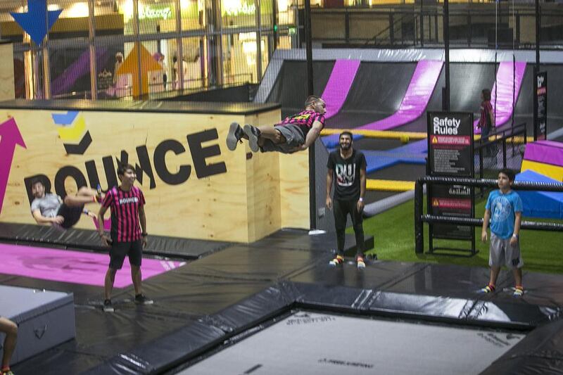 An instructor performs tricks at the opening of Bounce Abu Dhabi at Marina Mall. Mona Al Marzooqi / The National