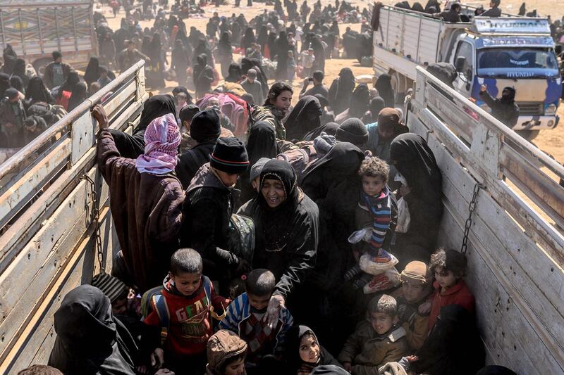 Women and children evacuated from the ISIS's holdout of Baghouz arrive at a screening area held by the US-backed Kurdish-led Syrian Democratic Forces. AFP