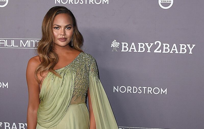 FILE - Chrissy Teigen arrives at the Baby2Baby Gala on Nov. 9, 2019, in Culver City, Calif. Teigen has written a heartfelt message about the recent loss of her third child with husband John Legend. Teigen delivered a lengthy essay in a Medium post Tuesday, Oct. 27, 2020. It's her first public response since she and Legend announced the loss of their son, Jack, in a heart-wrenching social media post with several photos on Sept. 30. (Photo by Jordan Strauss/Invision/AP, File)