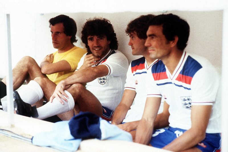 File photo dated 01-07-1982 - The substitutes' bench during England's World Cup match against Spain in Madrid.  (Left to Right) Goalkeeper Ray Clemence, injured captain Kevin Keegan, Glenn Hoddle and Trevor Brooking. PA Photo