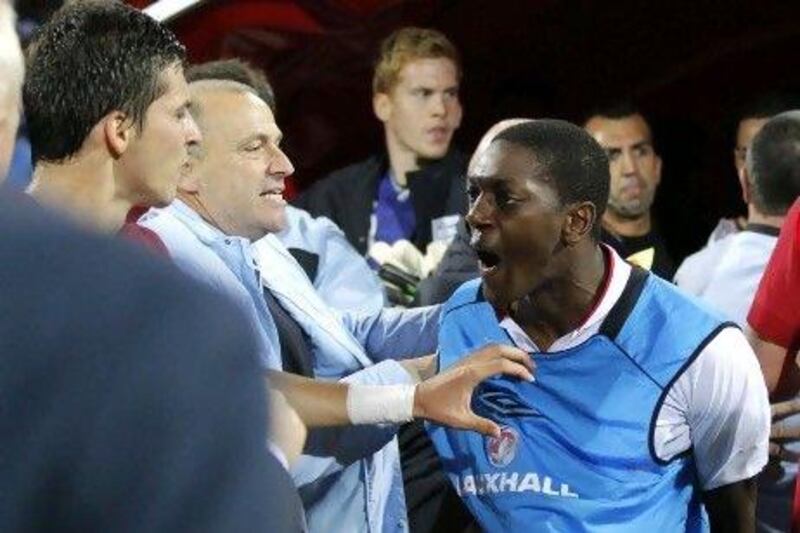 Marvin Sordell of England reacts angrily on the sidelines of the game.