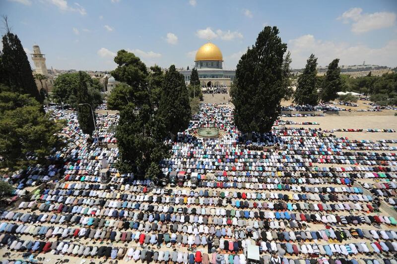 Palestinian Muslims pray  before the Noble Sanctuary  in the Al Aqsa complex in the Old City of Jerusalem  Ammar Awad / Reuters