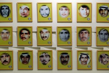 Portraits of some of around 605 missing people who were abducted by Iraqi forces line the walls of a memorial in Kuwait City. Reuters