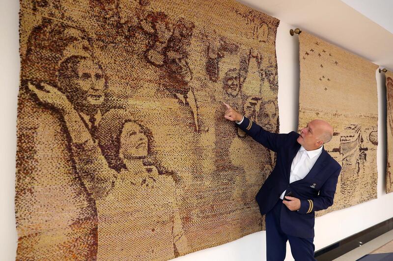 DUBAI , UNITED ARAB EMIRATES ,  October 15 , 2018 :- Peter Warwick, ex cruise director of the QE2 talking about the QE2 tapestries which are on display at the reception area near the Queen Elizabeth 2 ship in Dubai. ( Pawan Singh / The National )  For Weekend. Story by Hala Khalaf