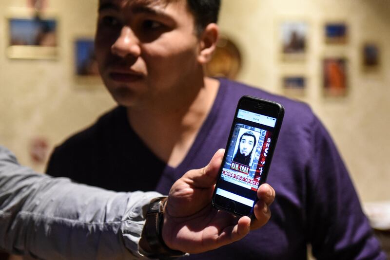 Amir Ganiev, age 27, looks at a picture of the Uzbek suspect in the deadly truck attack while working in an Uzbek restaurant in the borough of Brooklyn in New York City, U.S., November 1, 2017. REUTERS/Stephanie Keith NO RESALES. NO ARCHIVE