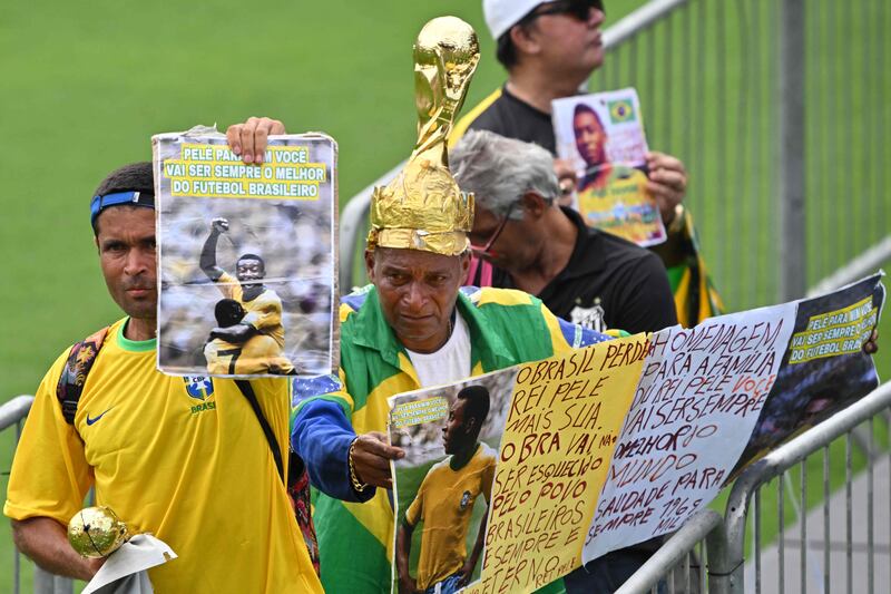 Mourners attend Brazil great Pele's wake at the Urbano Caldeira Stadium ahead of the funeral. AFP