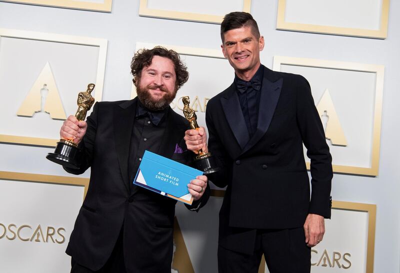 Best Animated Short Film: Michael Govier and Will McCormack, for 'If Anything Happens I Love You', pose in the press room at the Oscars on Sunday, April 25, 2021, at Union Station in Los Angeles. Reuters