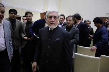 Abdullah Abdullah leaves after addressing a conference with his party members and few candidates in Kabul on Friday. AP