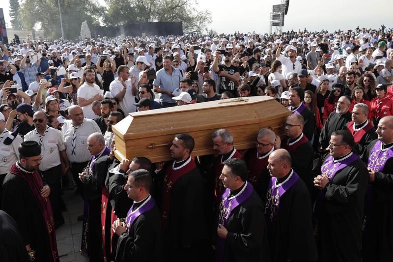 Monks carry the coffin of late former Maronite Patriarch Sfeir during his funeral in Bkerke. AFP