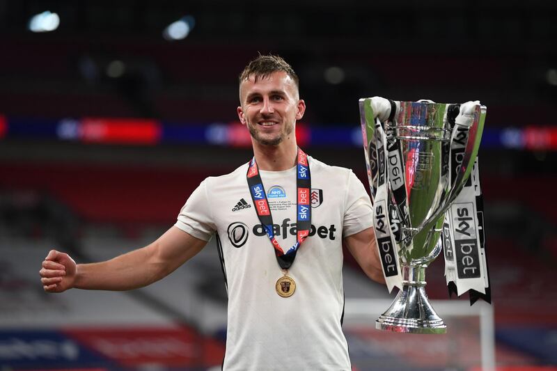 LONDON, ENGLAND - AUGUST 04: Goalscorer Joe Bryan of Fulham celebrates with the trophy after the Sky Bet Championship Play Off Final match between Brentford and Fulham at Wembley Stadium on August 04, 2020 in London, England. Football Stadiums around Europe remain empty due to the Coronavirus Pandemic as Government social distancing laws prohibit fans inside venues resulting in all fixtures being played behind closed doors. (Photo by Shaun Botterill/Getty Images)