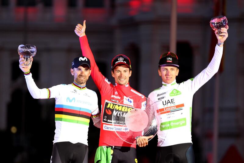 epa07845426 (L-R) Spanish rider Alejandro Valverde of Movistar Team, second position; Slovenian rider Primoz Roglic of Jumbo-Visma, first position; and Slovenian rider Tadej Pogacar of UAE Emirates, third position, celebrate on the podium at the end of Vuelta a Espana cycling race, after the 21st and last stage of over 106.6km from Fuenlabrada to Madrid, Spain, 15 September 2019.  EPA/JAVIER LIZON