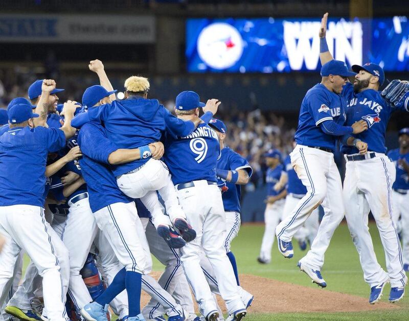 The Toronto Blue Jays celebrate after winning Game 5 of baseball’s ALDS on Wednesday night against the Texas Rangers. Frank Gunn / The Canadian Press / AP