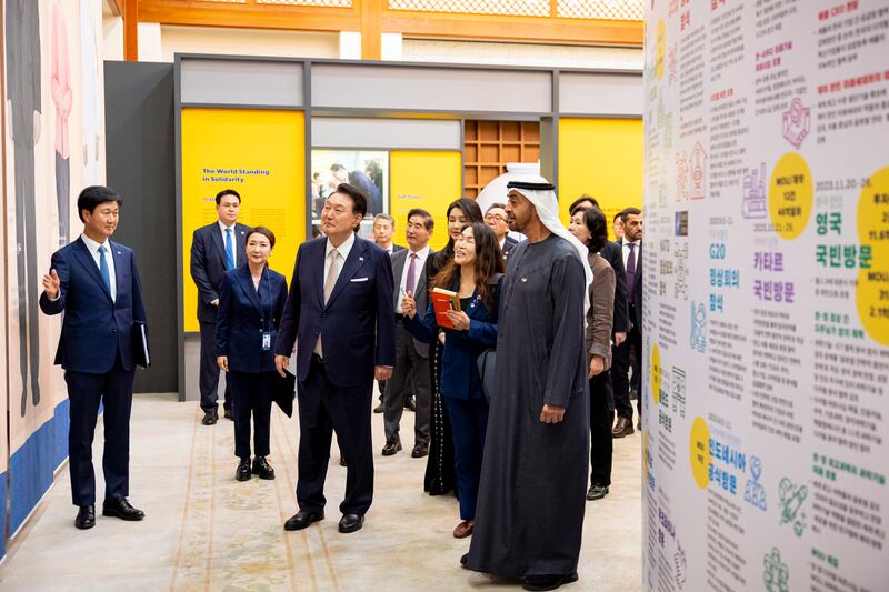 Sheikh Mohamed attends an exhibition after a dinner reception at the Blue House, hosted by Yoon Suk Yeol, President of the Republic of Korea. Ryan Carter / UAE Presidential Court