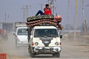 Syrians returning home to Hajin, Deir Ezzor province, after it was recaptured from ISIS. Delil Souleiman / AFP