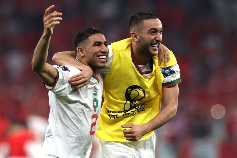 Morocco's defender Achraf Hakimi, left, celebrates with midfielder Hakim Ziyech. AFP