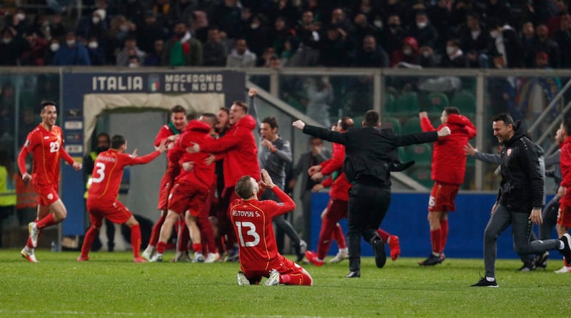 North Macedonia's Stefan Ristovski celebrates with teammates after the match. Reuters