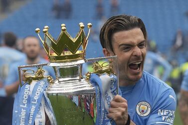 Jack Grealish of Manchester City celebrates with the trophy after winning the English Premier League title following the English Premier League soccer match between Manchester City and Aston Villa in Manchester, Britain, 22 May 2022.   EPA/ANDREW YATES EDITORIAL USE ONLY.  No use with unauthorized audio, video, data, fixture lists, club/league logos or 'live' services.  Online in-match use limited to 120 images, no video emulation.  No use in betting, games or single club / league / player publications