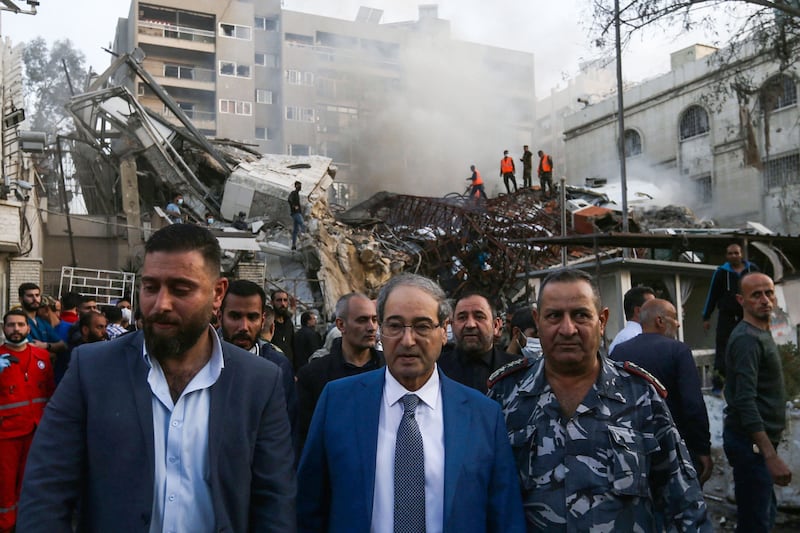Syrian Foreign Minister Faisal Mekdad (centre) visits the  embassy compound, in the central Mezzeh area of the city. AFP